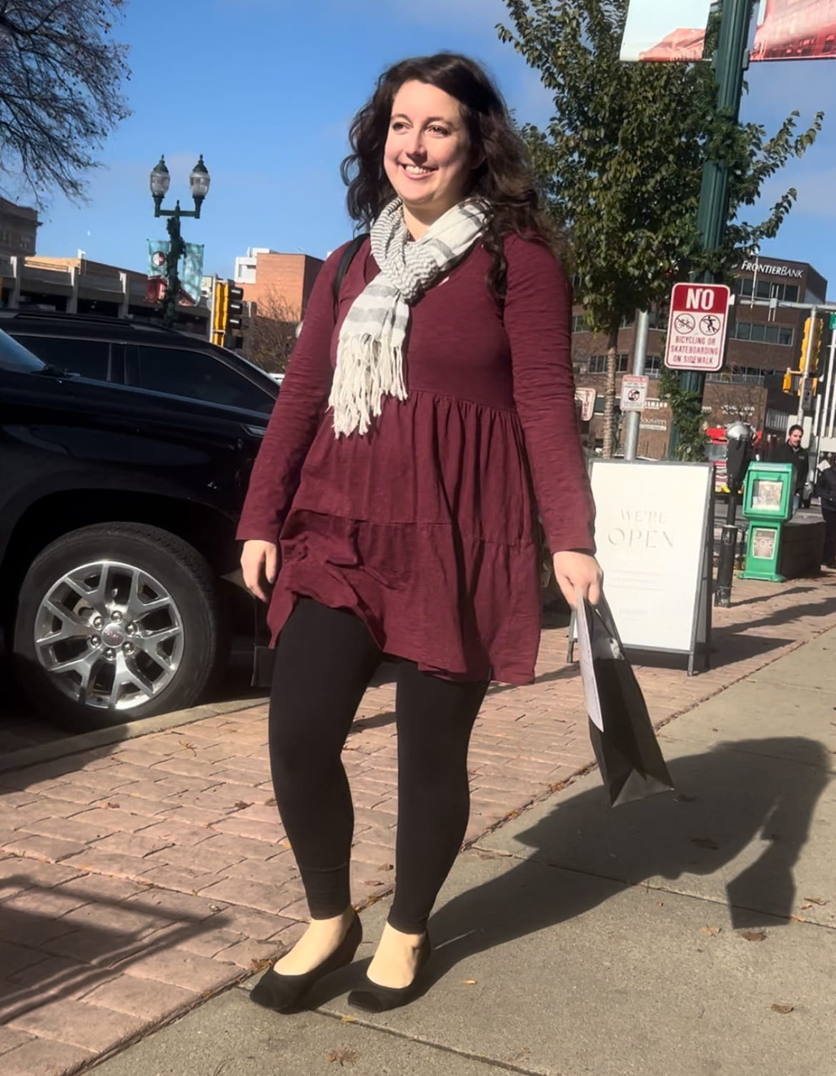 A photo of me walking downtown that my 4-year-old snapped while we were making Instagram reels to promote the BINGO game. Sioux Falls Simplified is a family affair here.